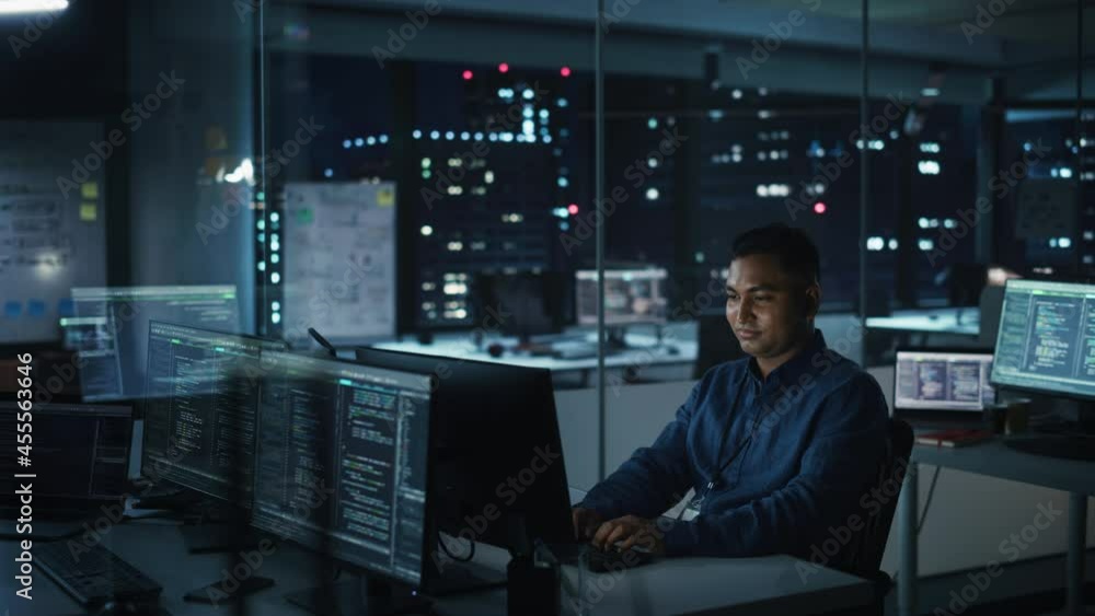 Poster night office: portrait of handsome indian man in working on desktop computer. digital entrepreneur t