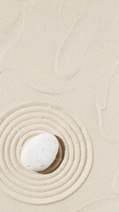 Fototapeta na wymiar Background with zen stone on sand. Zen Garden with concentric circles around pebble