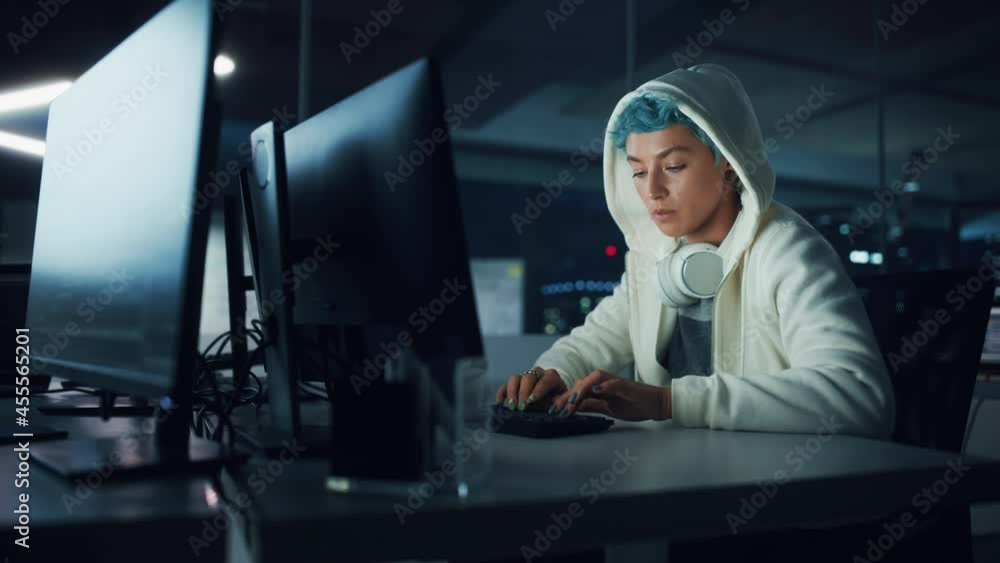 Aufkleber late at night in office: portrait of young stylish freelancer woman working on desktop computer. non
