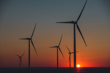 Wind Turbines producing energy at sunset