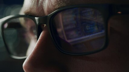 Close-up Portrait of Software Engineer Working on Computer, Line of Code Reflecting in Glasses. Developer Working on Innovative e-Commerce Application using Big Data Concept