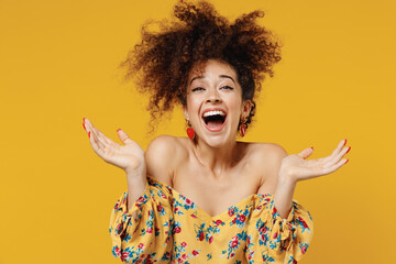 Young happy satisfied excited fun surprised amazed woman 20s with culry hair in casual clothes...