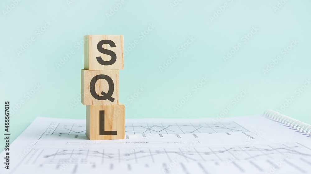 Poster the word sql structured query language, lined with wooden blocks.