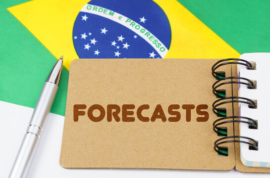 On the flag of Brazil lies a notebook with the inscription - forecasts