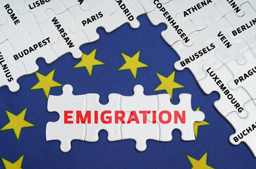The EU flag has city name puzzles and puzzles with the words - emigration