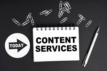On a black background, a round plate - Today and a notebook with the inscription - Content Services