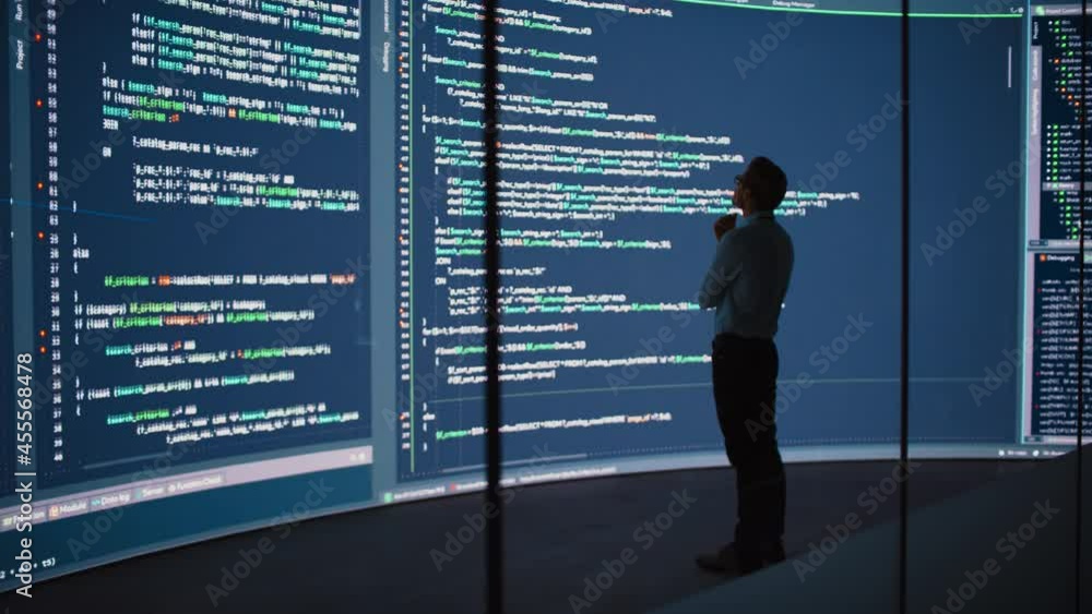 Poster High-Tech Startup Concept: Innovative Male Software Engineer Standing, Doing Big Data Analysis on Wall Screen Showing Porgramming Code. Developing Futuristic e-Commerce App with Machine Learning. Full