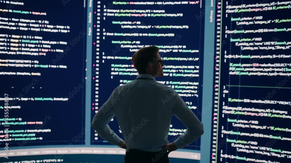 Poster Innovative Startup Concept: Thoughtful Software Engineer Finding Solution, Solving Problem, Standing and Doing Data Analysis on Big Wall Screen. Programmer Developing e-Commerce App.Dramatic Back View