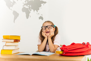 Girl studing at table on white background