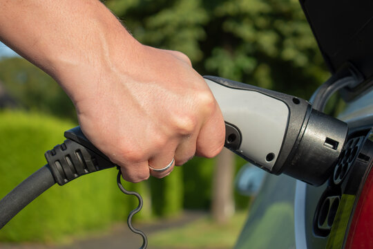 Eletric car charging photo closeup
