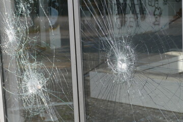 Broken thick security glass after burglary in business pavilion. Hanover, Lower Saxony, Germany.