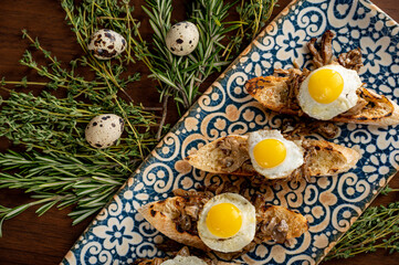 Fried Quail Eggs over Hen-of-the-Woods Mushrooms on Toast