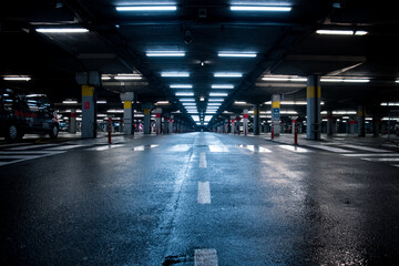 Reflective wet neon lit garage
