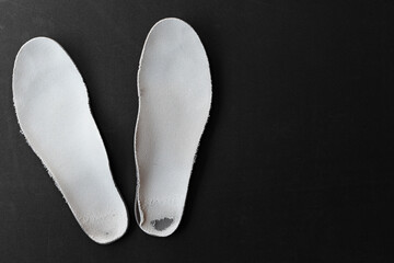 Soles of shoes damaged and worn by improper walking. Concept of weight distribution during walking that damages shoes in specific points. Baropodometry test. Examination of the load of the feet.