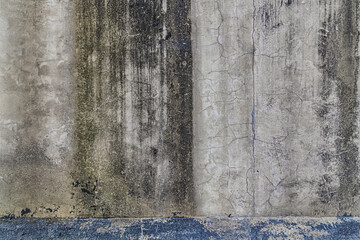 abstract background of an old shabby painted white and blue concrete wall close up