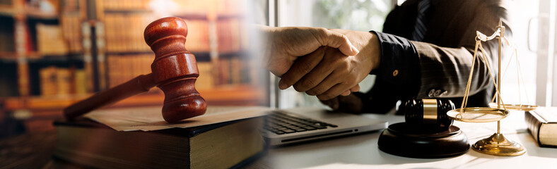 justice and law concept.Male judge in a courtroom on wooden table and Counselor or Male lawyer working in office. Legal law, advice and justice concept.