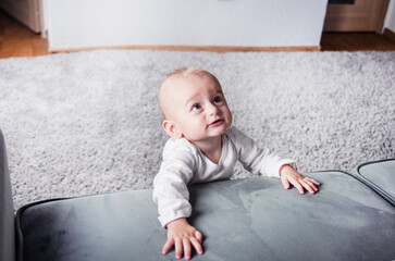 Naklejka premium portrait of a beautiful emotional baby with big beautiful eyes 