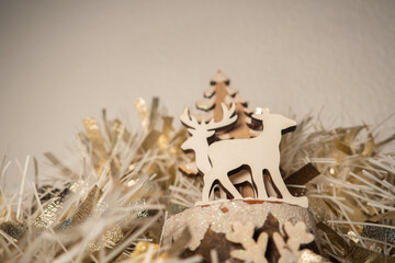 Wooden christmas decoration with gold garland