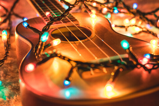 Acoustic guitar in Christmas light