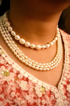 Close-up of a woman neck wearing necklace