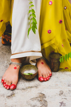 Cropped image of woman's henna feet