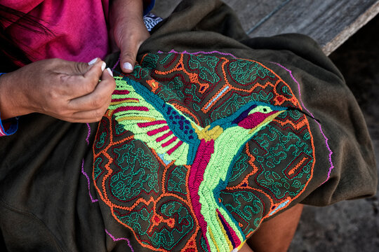Cropped hand of a woman doing embroidery