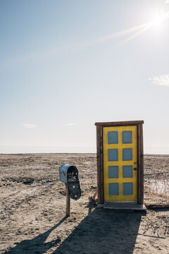 Door and mail box in desert