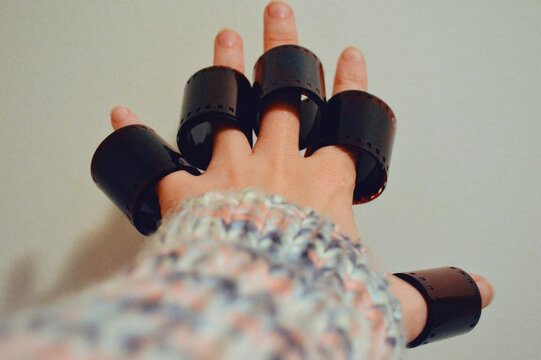 Girl putting films to her fingers