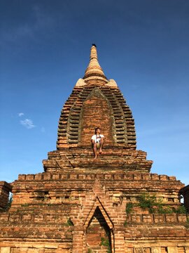 Man sitting on top of  Gubyaukgyi Temple