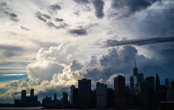 One World Trade and Manhattan skyline under thunderclouds, NYC, summertime