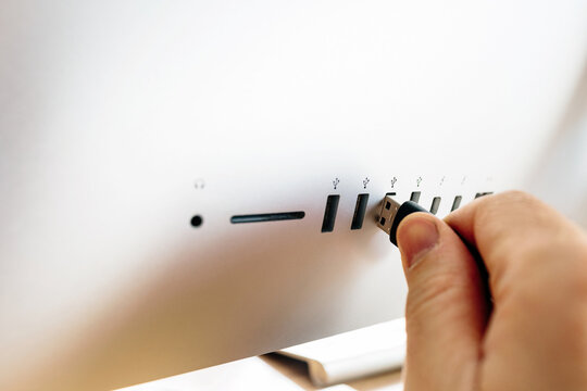Person inserting a USB