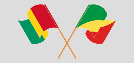 Crossed and waving flags of Guinea and Republic of the Congo