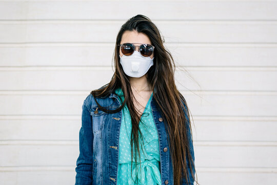 Portrait of a Woman in a white face mask