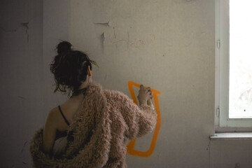 Woman doing graffiti