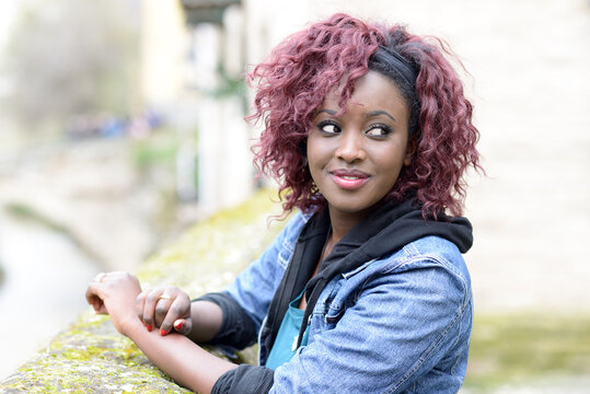 Woman in blue denim button up vest and blue denim vest