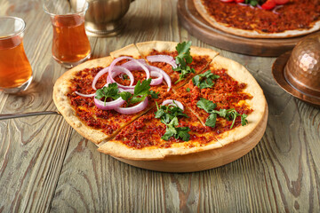 Delicious Turkish pizza on wooden background