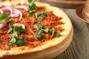 Delicious Turkish pizza on wooden background