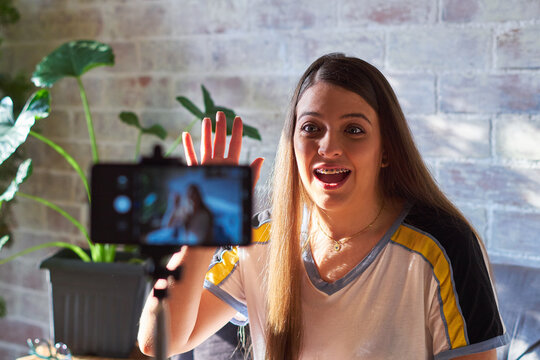 Woman videotaping herself talking