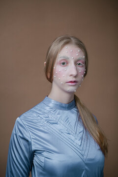 Woman with pearl face painting