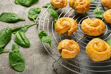 Puff pastry stuffed with spinach on grunge background