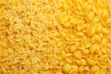 Heap of uncooked pasta as background
