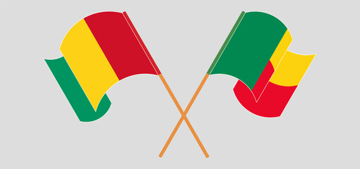 Crossed and waving flags of Guinea and Benin