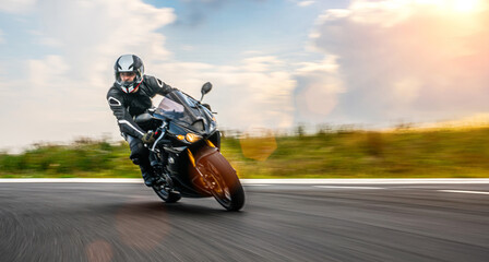 motorbike on the road riding. having fun riding the empty road on a motorcycle tour / journey