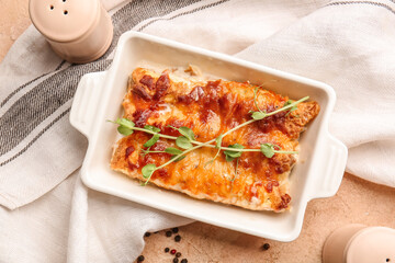 Delicious casserole with minced meat in baking dish on table