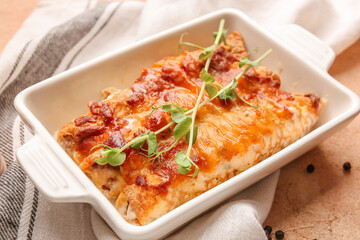 Delicious casserole with minced meat in baking dish on table