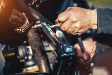 Mechanic working in garage. Repair service.