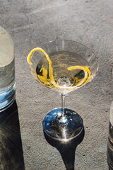 martini glass with a lemon twist happy hour 