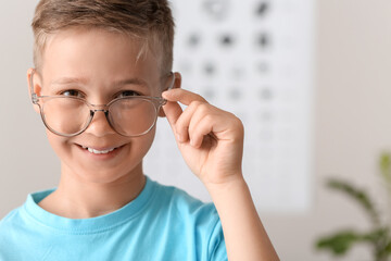 Little boy undergoing eye test in clinic