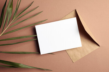 Greeting or invitation card mockup with palm tree leaf decorations