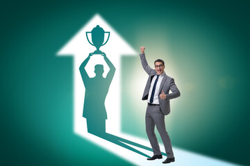 Businessman dreaming of top prize in business concept